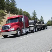 flatbed-semi-truck-hauling-wire-cargo-trucking-coil-freight-79875064 flatbed-semi-truck-hauling-wire-cargo-trucking-coil-freight-79875064